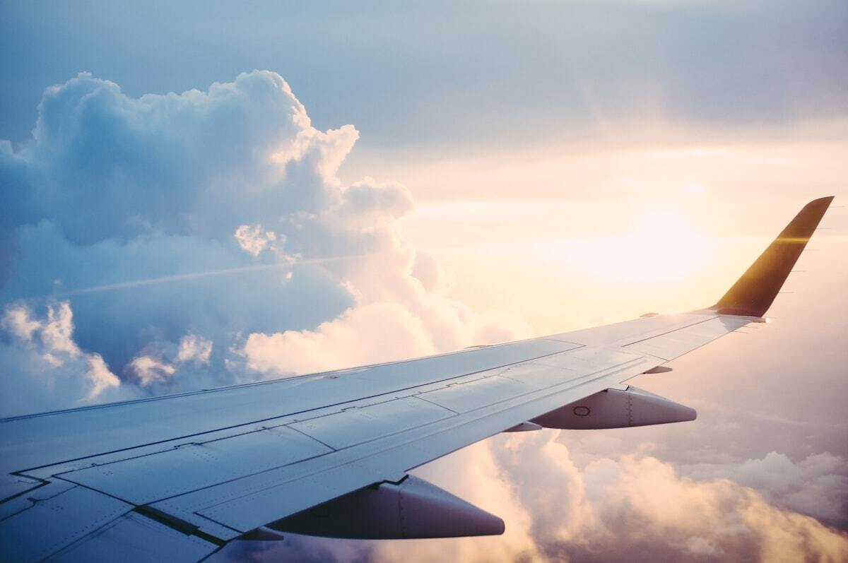 View from an airplane window symbolizing the travel freedom of digital nomad jobs